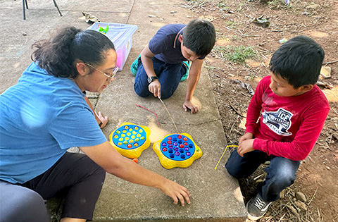 A GSG Missions team member running a children's activity in a Guatemalan village.