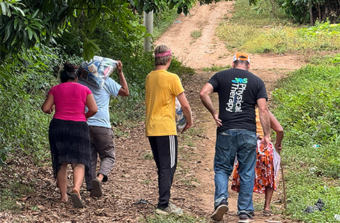 Food bag distribution following a GSG Missions mobile medical clinic.